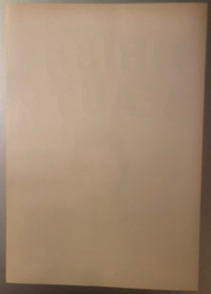 Blank cream-colored vintage crate label with shadow cast from right edge, viewed flat against neutral background