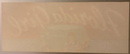 Cream-colored vintage citrus crate label with faint printed text and imagery, showing wear and age marks on paper surface