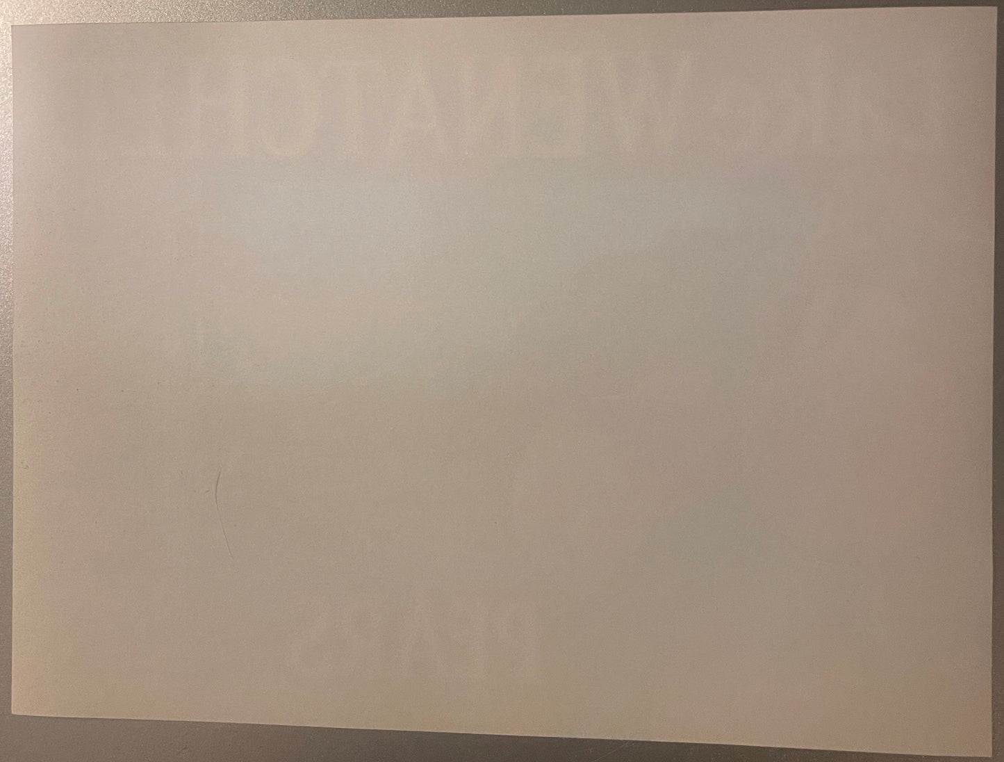 Blank cream-colored vintage crate label on neutral background, showing minimal visible printing or graphics