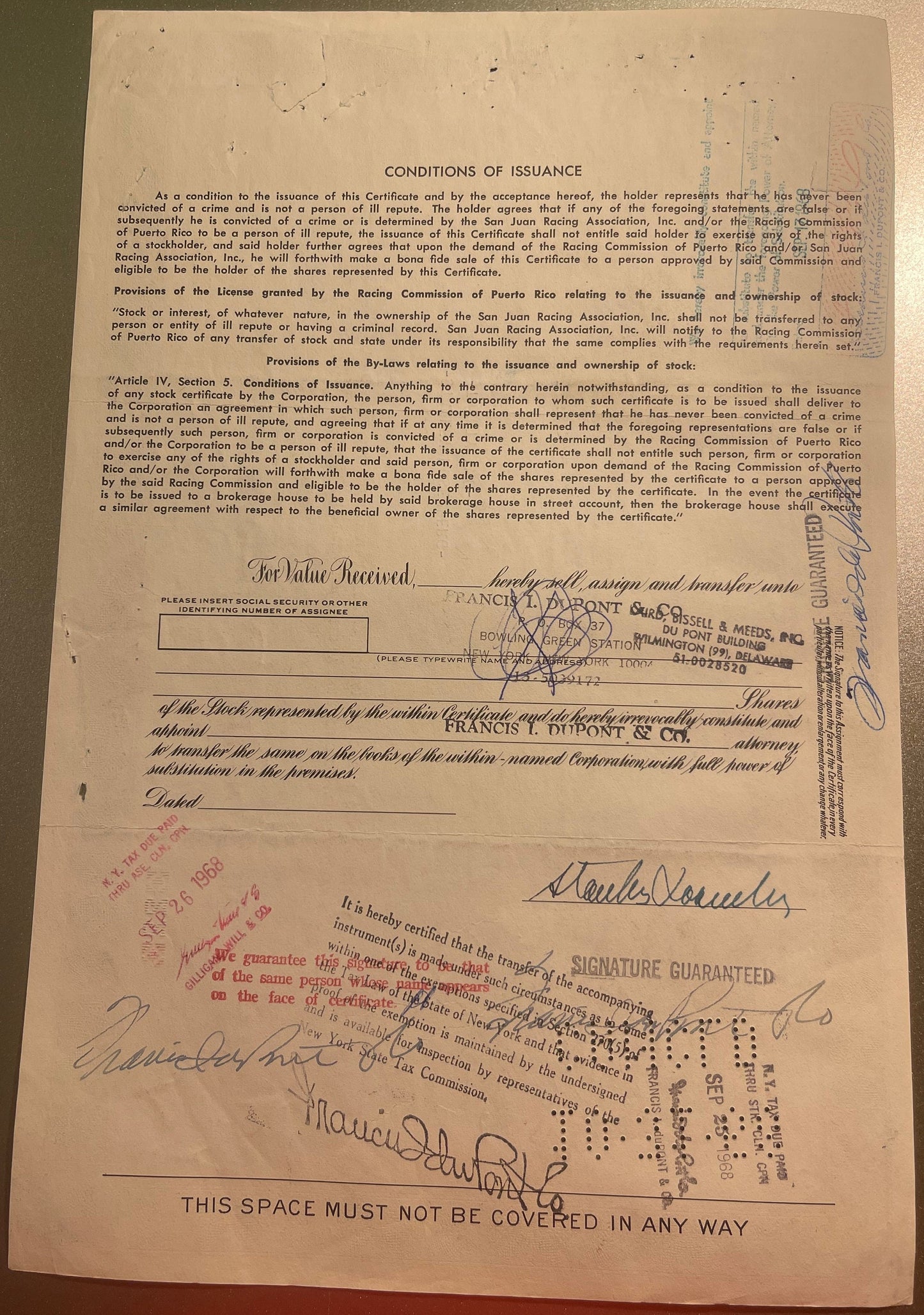 Aged stock certificate with "Conditions of Issuance" text, signatures, and stamps from San Juan Racing Association and Franci