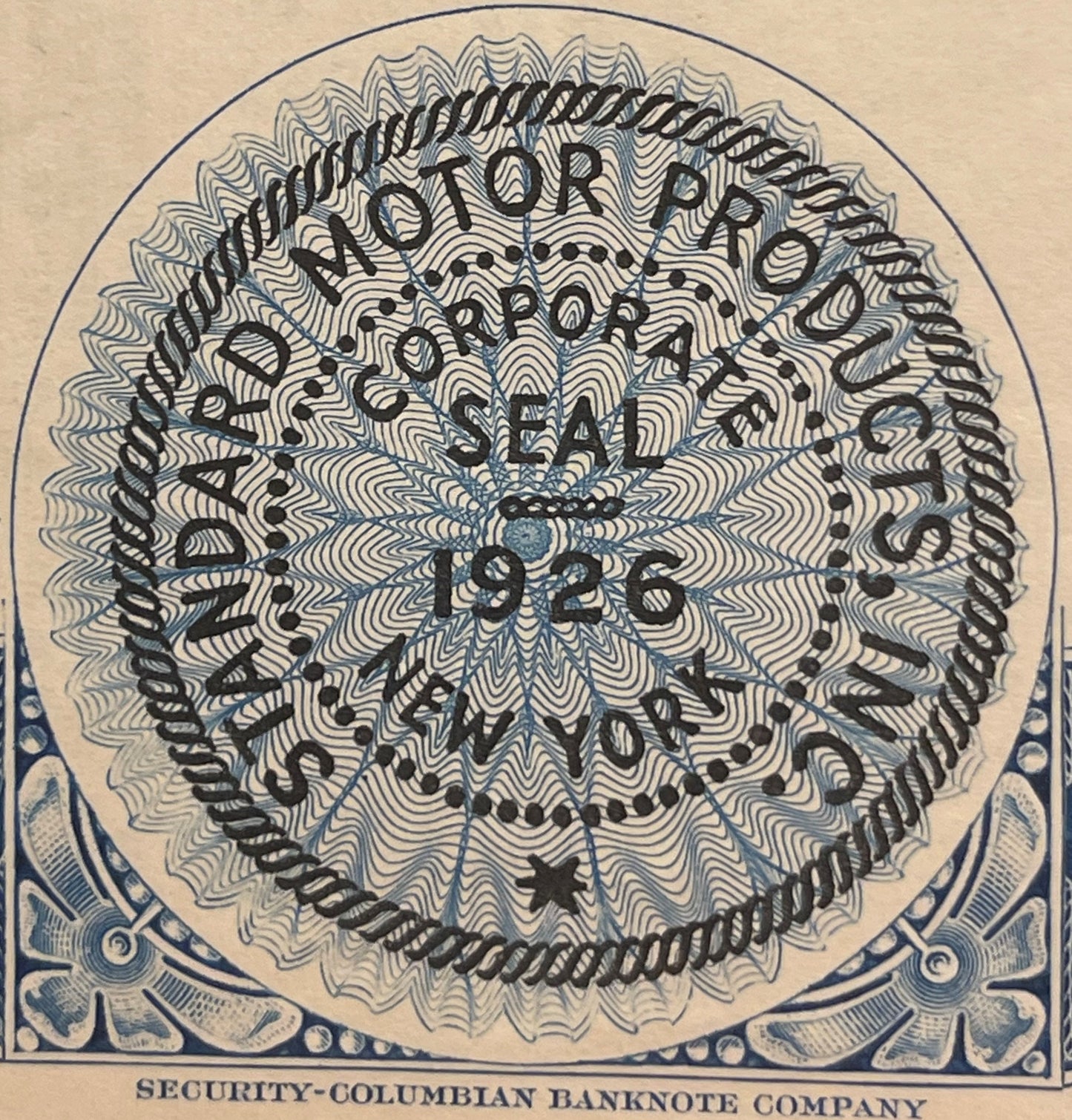 Circular guilloche security pattern with ornate text overlay on cream paper, blue decorative corner borders, "SECURITY-COLUMB