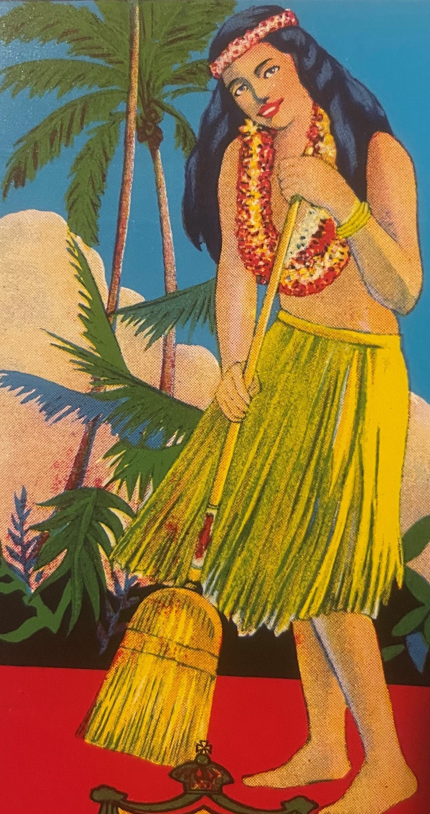 Vintage chromolithograph label featuring a hula girl in yellow grass skirt and lei standing beside palm trees and a broom aga