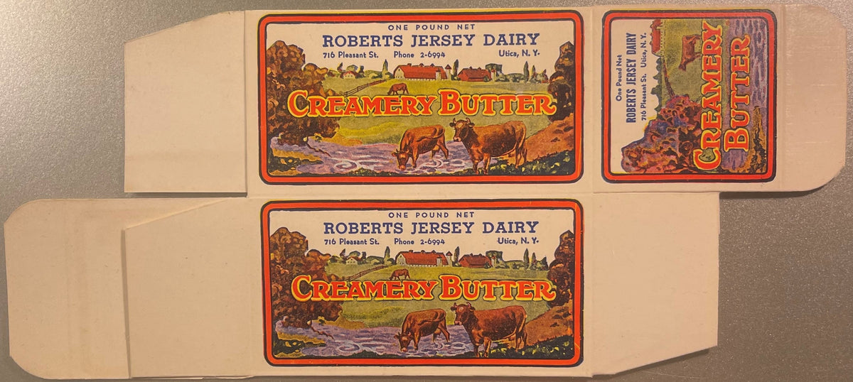 Unfolded vintage butter box with two identical pastoral labels showing cows by water, "Roberts Jersey Dairy Creamery Butter" 