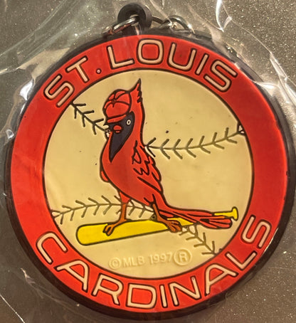 Red and cream circular keychain with St. Louis Cardinals logo featuring cardinal bird on yellow baseball bat, surrounded by r