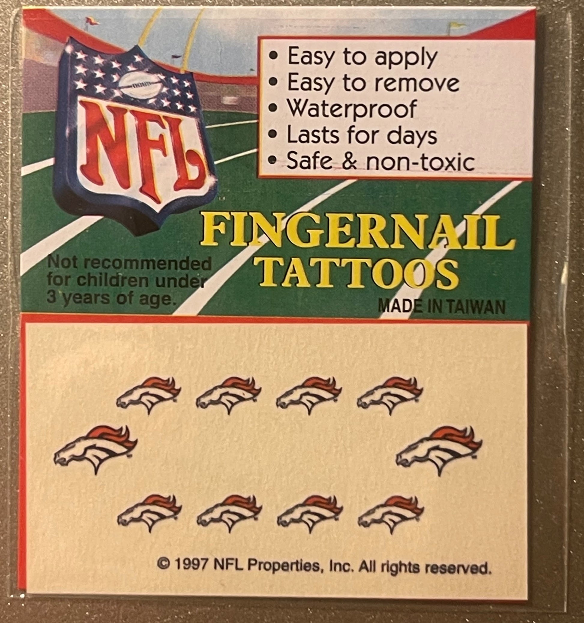 Vintage 1997 NFL Denver Broncos fingernail tattoos package showing orange horse logo and ten small tattoo designs on tan back