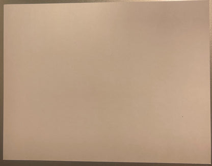 Blank beige rectangular card or cling material photographed flat against a gray background