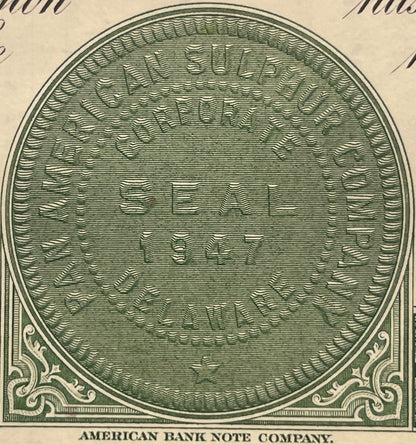 Green engraved circular vignette from American Bank Note Company, featuring ornate decorative corners, printed on aged cream 