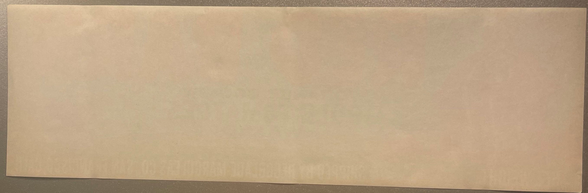 Blank cream-colored vintage crate label on gray background, front view showing plain paper surface with no visible text or pr
