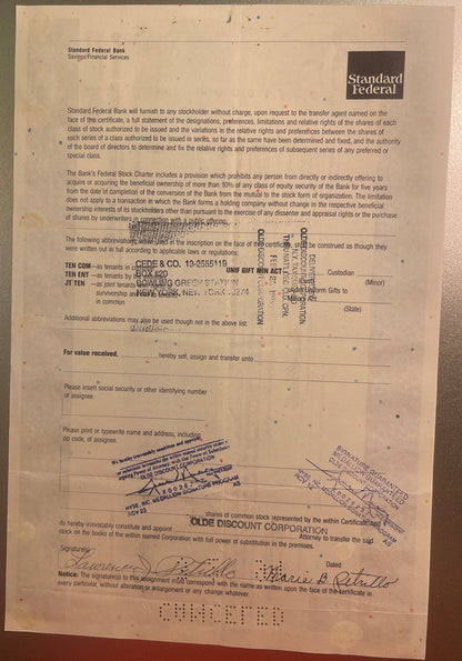 Aged paper stock certificate from Standard Federal Bank with printed text, handwritten signatures, and ru