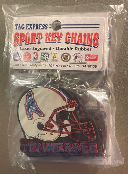 Sealed plastic package containing red and white Tennessee Oilers football helmet keychain by Tag Express, viewed from front