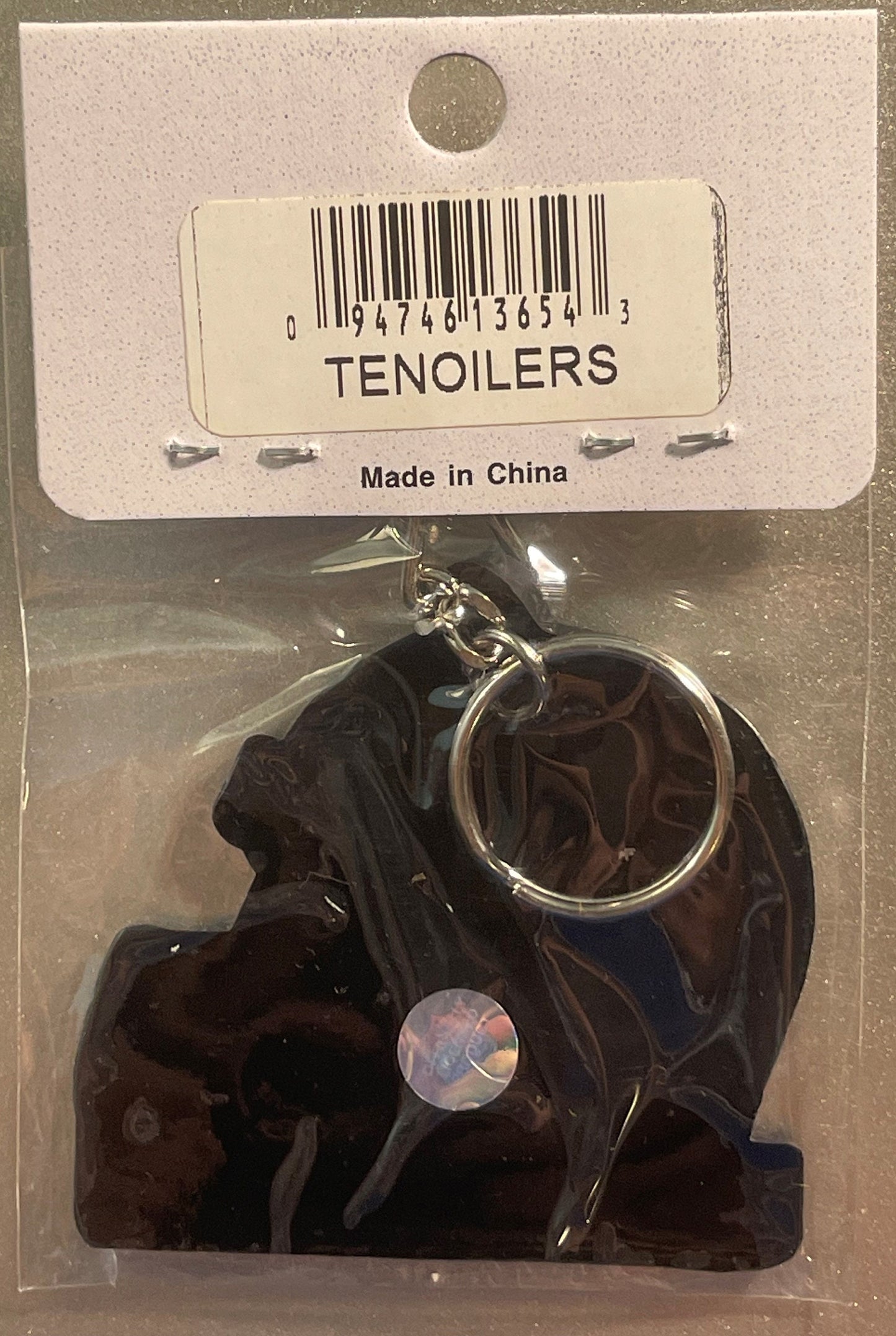 Dark blue NFL helmet keychain in original packaging with barcode label and "Made in China" text, displayed with penny for sca