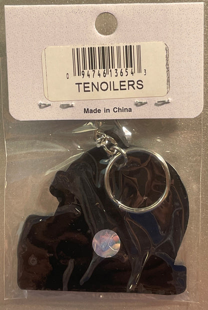 Dark blue NFL helmet keychain in original packaging with barcode label and "Made in China" text, displayed with penny for sca