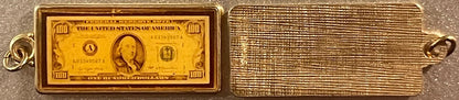 Gold bracelet with a mini $100 bill charm from Vintage 1970s keychain fobs