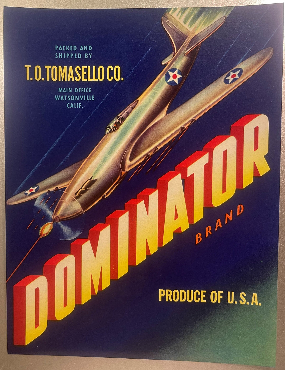 Vintage fruit crate label featuring two P51 Mustang fighter planes in flight against dark blue background with "Dominator Bra