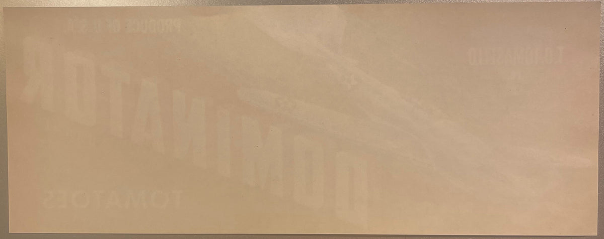 Back of the horizontal Dominator Tomatoes label, blank paper with the front lettering showing through in reverse
