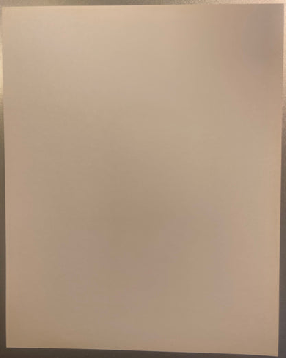 Blank cream-colored page or print backing, photographed flat against a neutral background