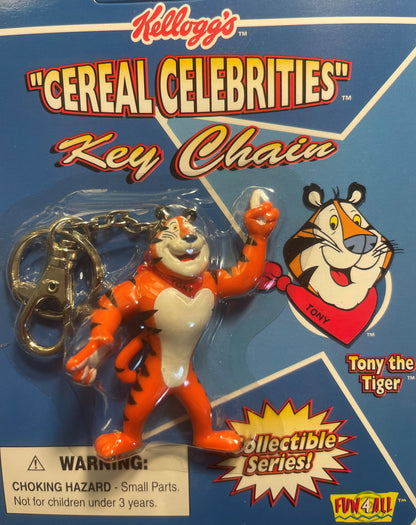 Vintage 1998 Kellogg's Cereal Celebrities Tony the Tiger keychain in original packaging, orange and cream tiger figure with m