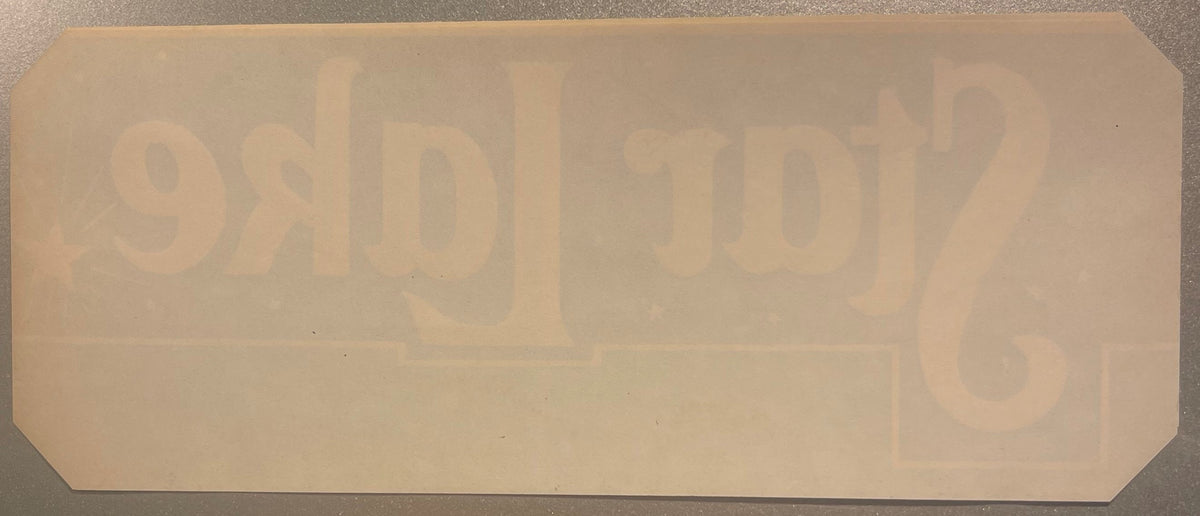Blank back of the Star Lake crate label with the front lettering showing through in reverse