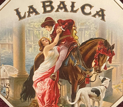 Vintage La Balca cigar label featuring gold-embossed text and an illustration of a man on horseback lifting a woman in a red 