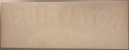 Faded vintage fruit crate label with barely visible text on cream-colored paper, photographed flat against neutral background