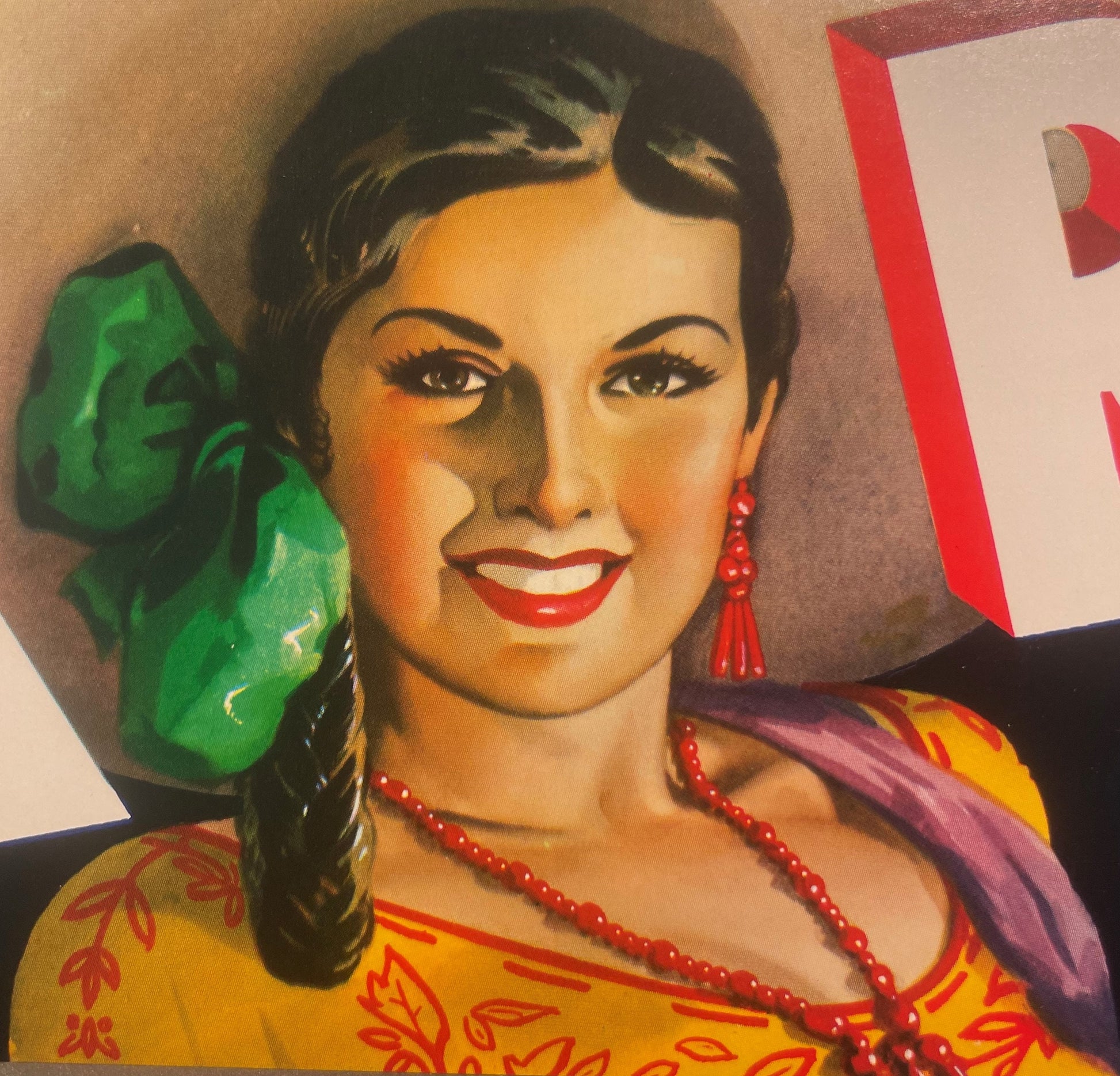 Vintage Tex Rio Tomatoes crate label featuring a woman's portrait with dark hair, red lips, beaded necklace, and colorful clo