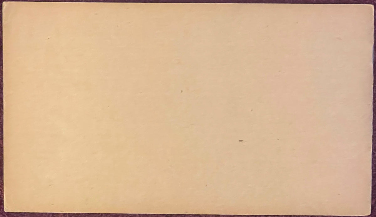 Blank cream-colored page from a vintage railroad foreman time book, showing age spots and wear marks against a dark binding e