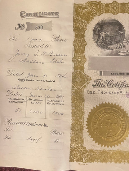 Two pages of a stock certificate for 1,000 shares, Idaho, with ornate gold borders