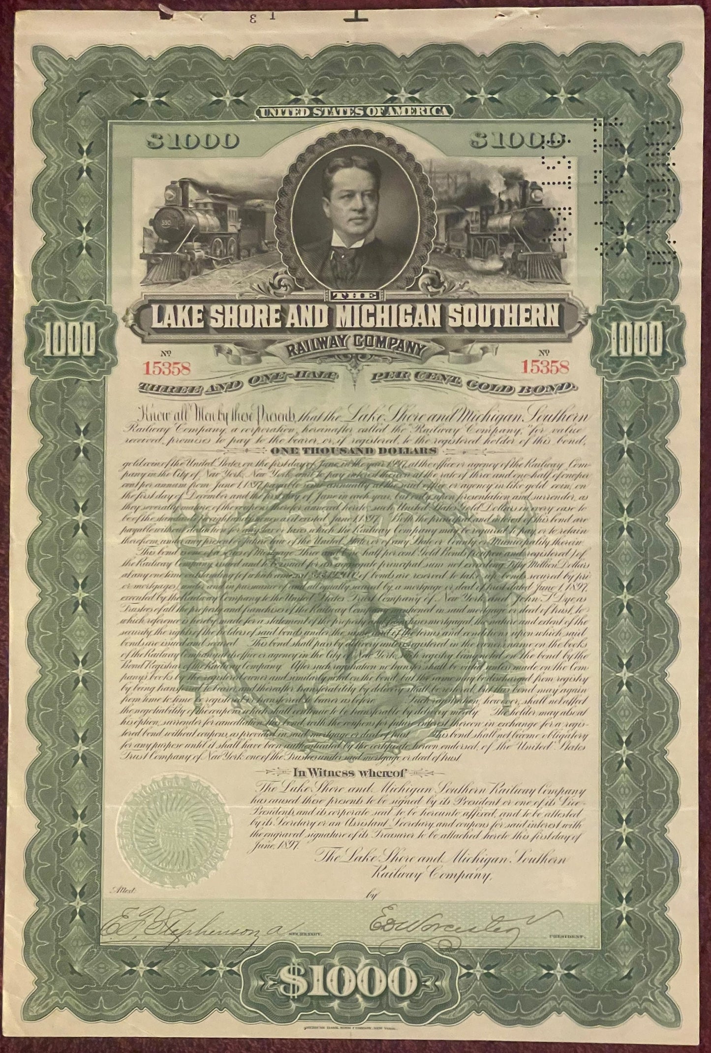 Ornate 1897 Lake Shore and Michigan Southern Railway $1000 gold bond certificate with portrait, train vignettes, and decorati