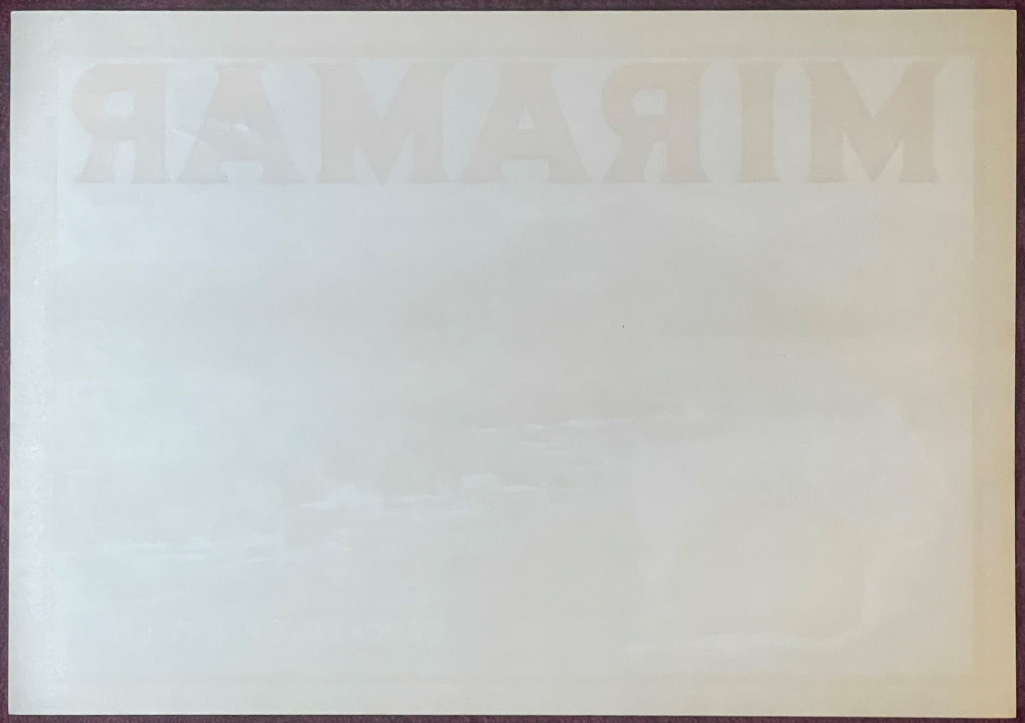 Faded vintage Miramar Sunkist lemon crate label showing watermarked text on cream-colored paper, photographed flat against ne