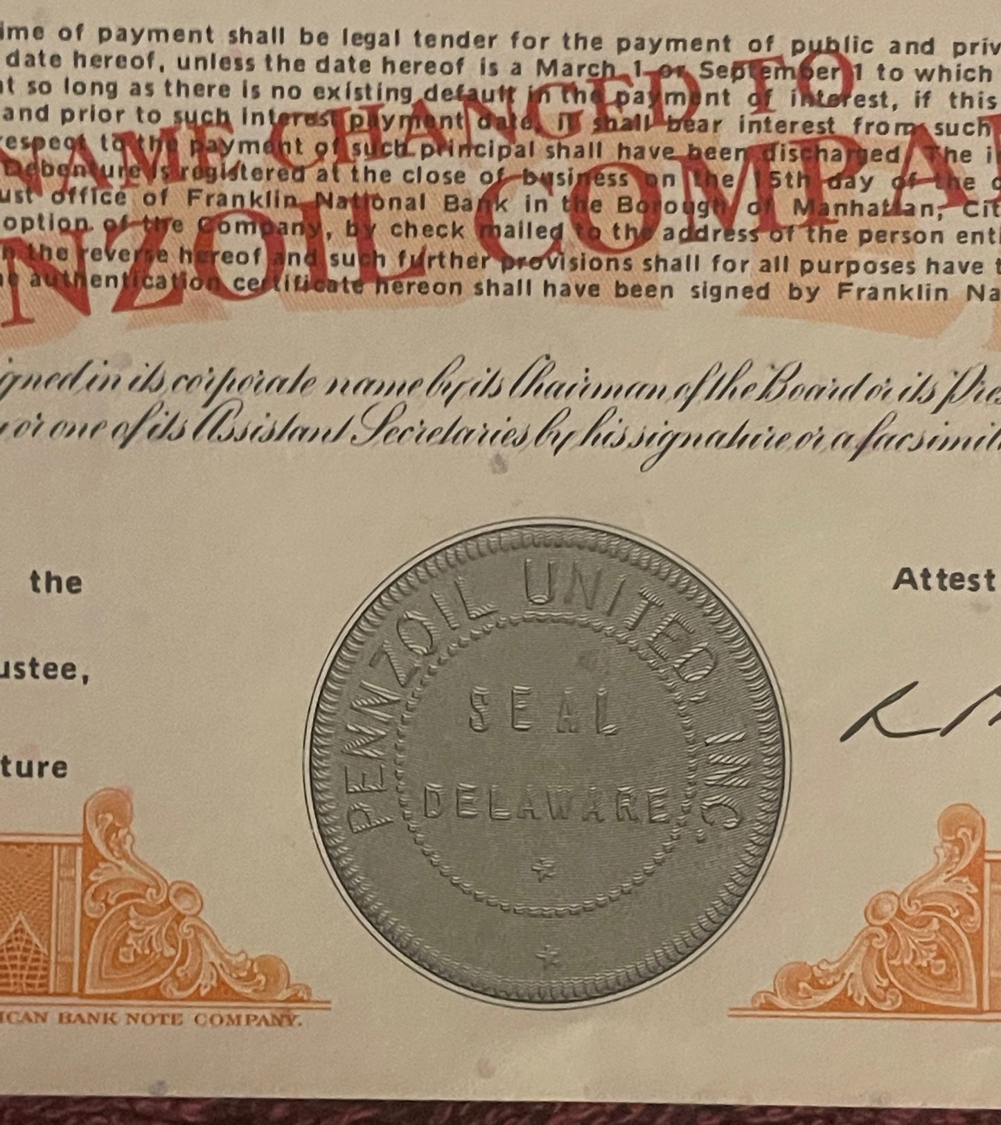 Vintage stock certificate with red "PAID" stamp overlay, ornate corner designs, and a seal coin displayed for scale against p