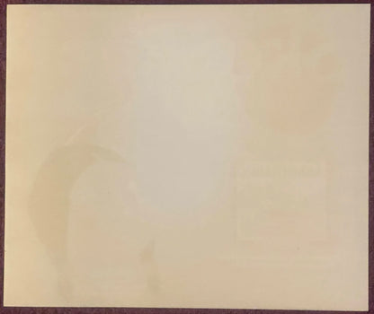 Blank cream-colored vintage crate label with dark brown border, showing age spots and wear