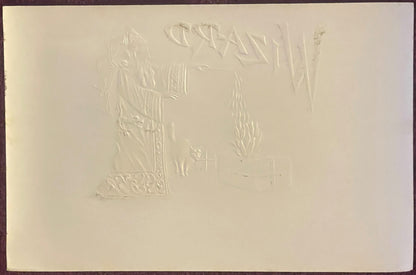Cream-colored embossed cigar label showing a figure in robes with decorative ornamental border and text at top, photographed 