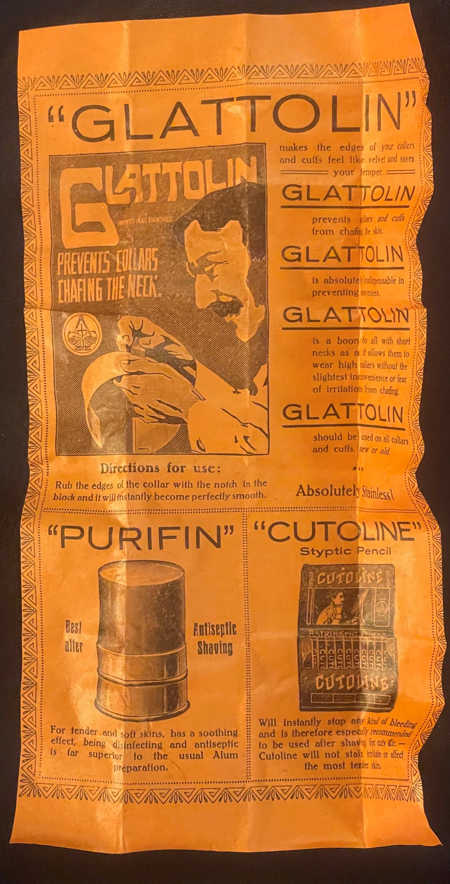 Antique orange cardboard box for Glattolin collar remedy featuring product information and illustrated man's face, displayed 