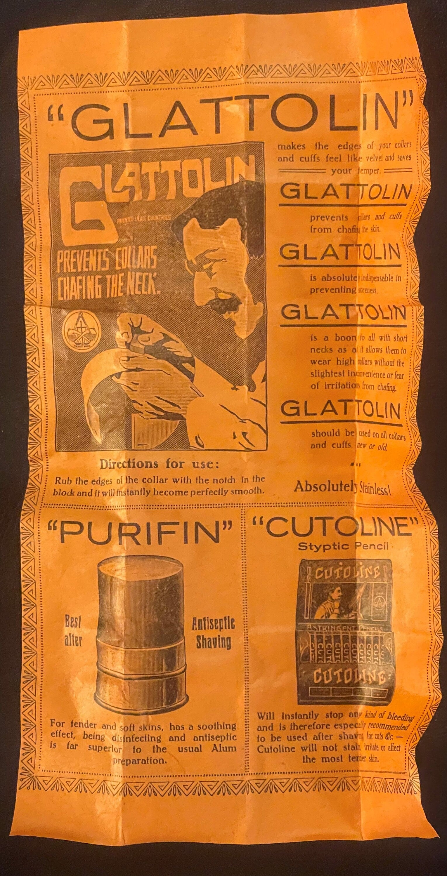 Antique orange cardboard box for Glattolin collar remedy featuring product information and illustrated man's face, displayed 