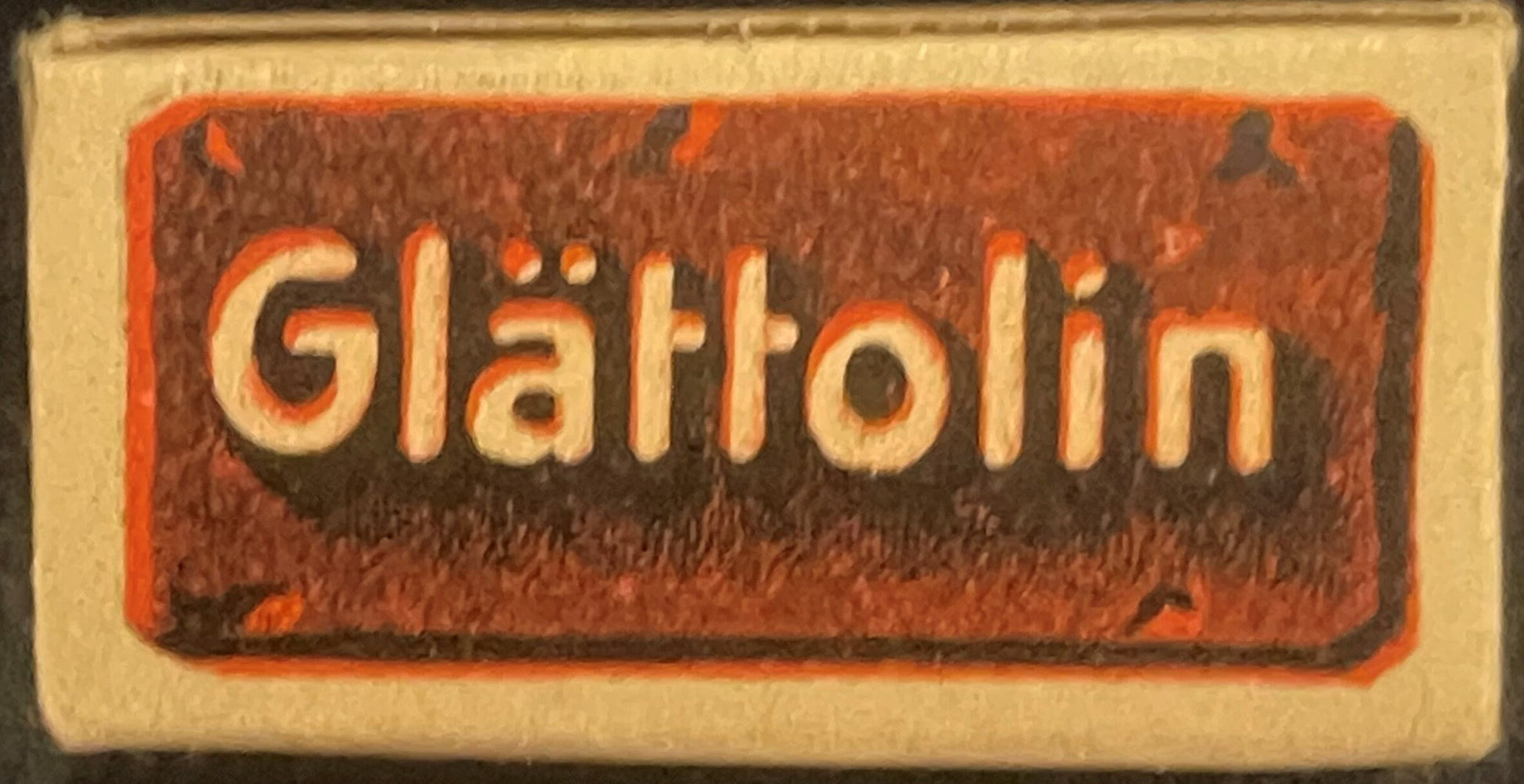 Vintage Glattolin box with cream-colored background and red-bordered label featuring cream-colored embossed lettering on brow