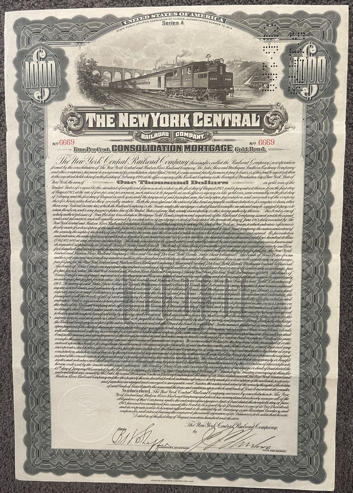 Antique 1913 New York Central Railroad $1000 gold bond certificate with steam locomotive vignette, ornate border, and handwri