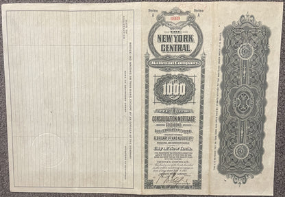 Antique New York Central Railroad gold bond certificate from 1913, showing ornate decorative borders and text on aged cream-c