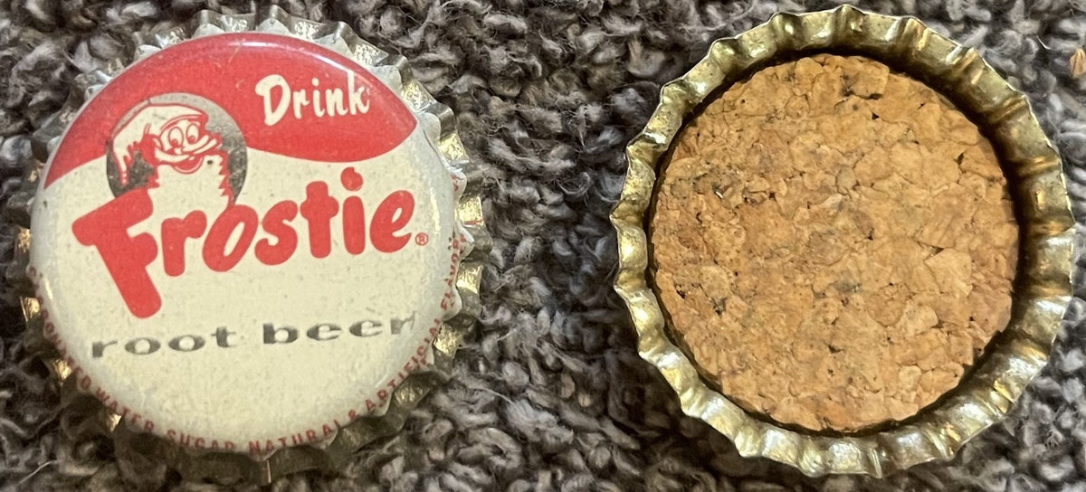 Frostie root beer crown cap: the red and white printed top with the elf and Drink Frostie root beer, beside a cap's cork-lined underside.
