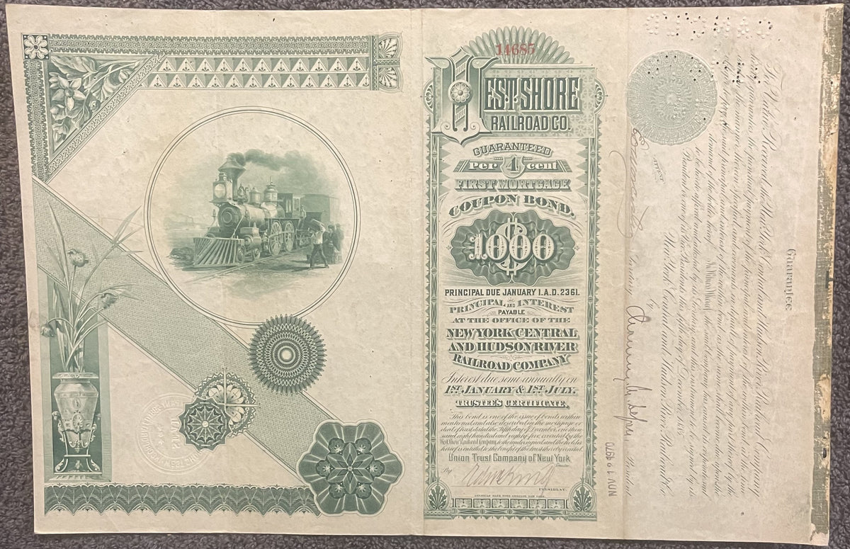 Antique railroad bond certificate with green engraved locomotive vignette, decorative borders, and "$1000" denomination text 