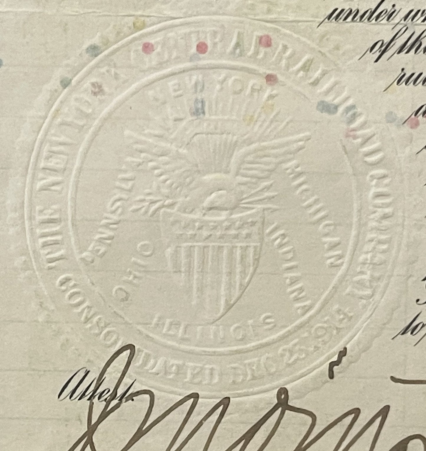 Close-up of embossed seal on aged bond certificate with eagle and shield, handwritten signature below, colored wax seals visi