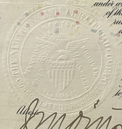 Close-up of embossed seal on aged bond certificate with eagle and shield, handwritten signature below, colored wax seals visi