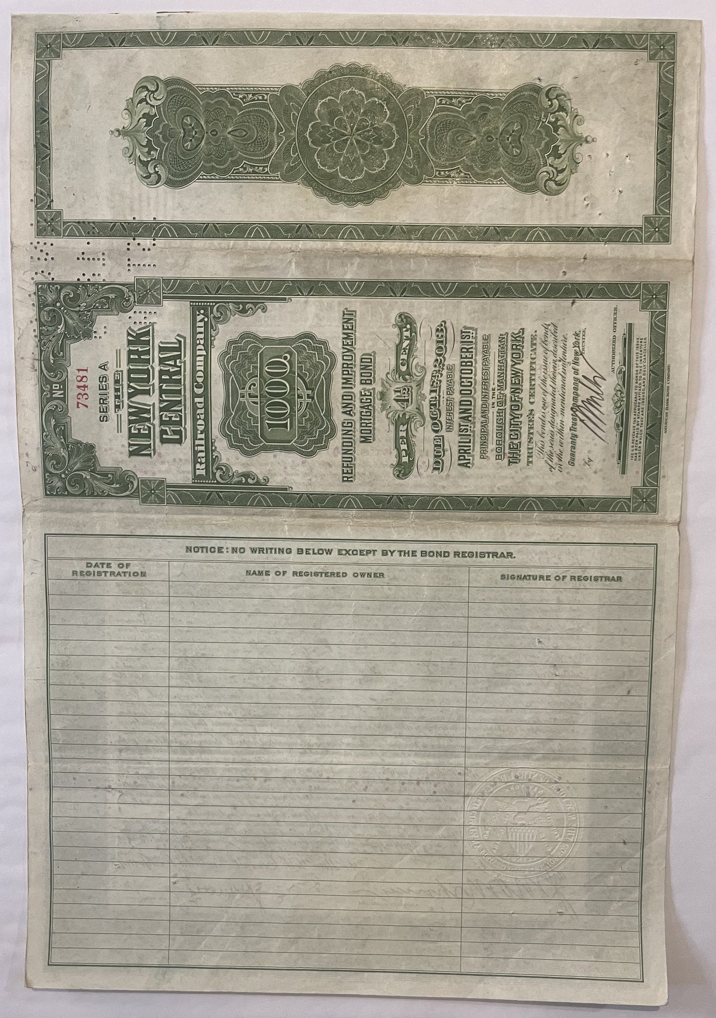 Vintage New York Central Railroad $1,000 bond certificate from 1913 with ornate green decorative borders and registration sec