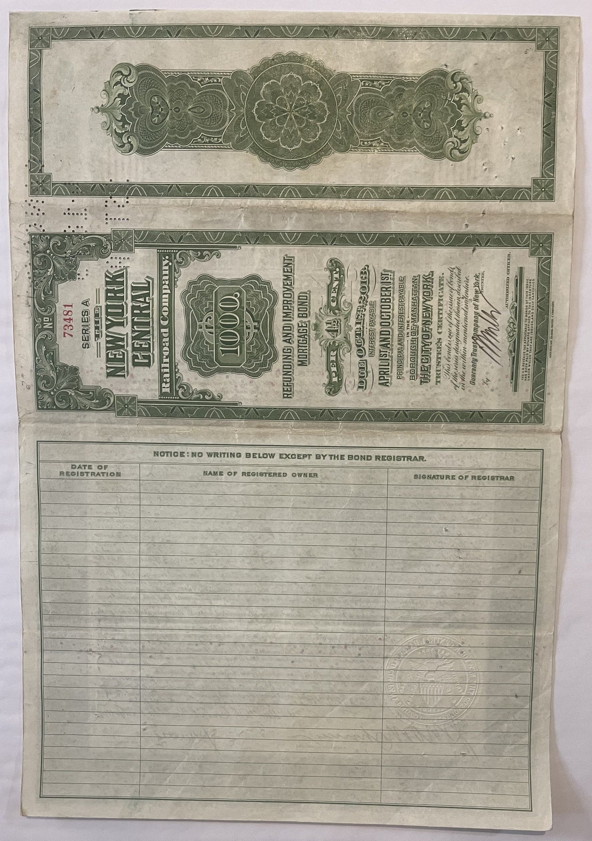 Vintage New York Central Railroad $1,000 bond certificate from 1913 with ornate green decorative borders and registration sec