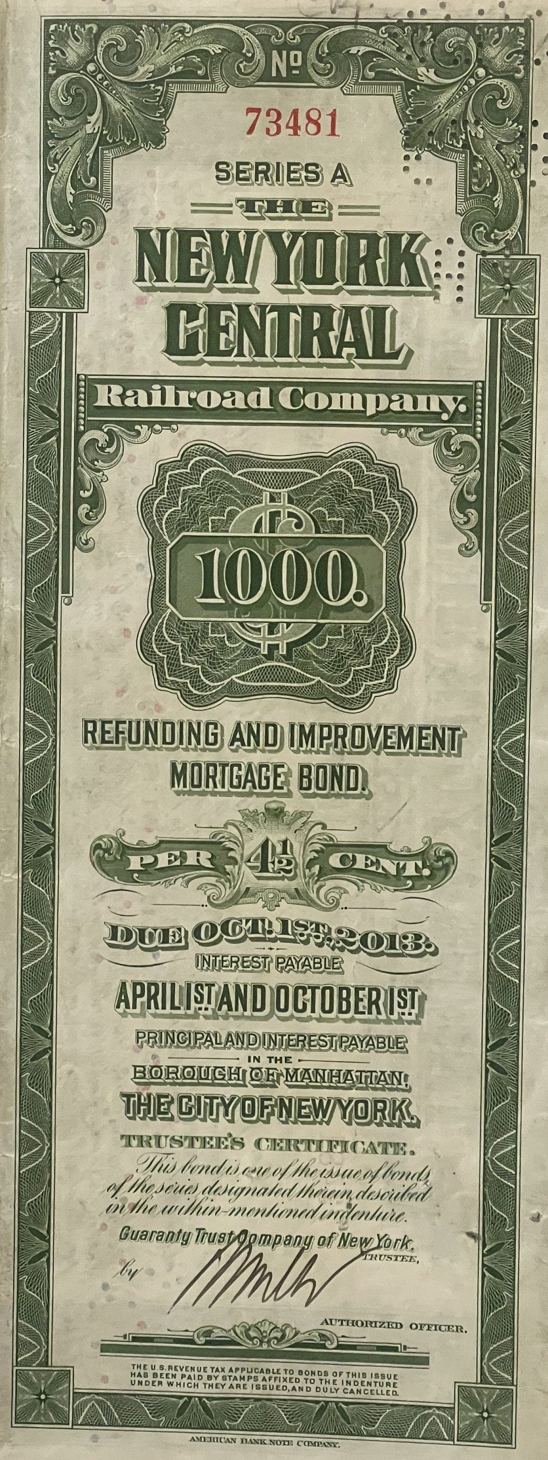 Vintage 1913 New York Central Railroad $1,000 bond certificate with ornate green borders and decorative typography on aged pa