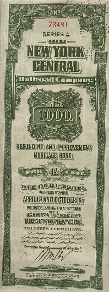Vintage 1913 New York Central Railroad $1,000 bond certificate with ornate green borders and decorative typography on aged pa