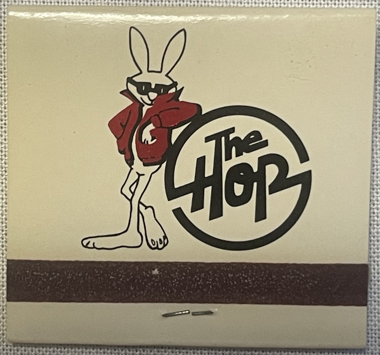 Vintage matchbook cover featuring a cartoon rabbit in red jacket next to "The 4407" text in circular logo on cream background