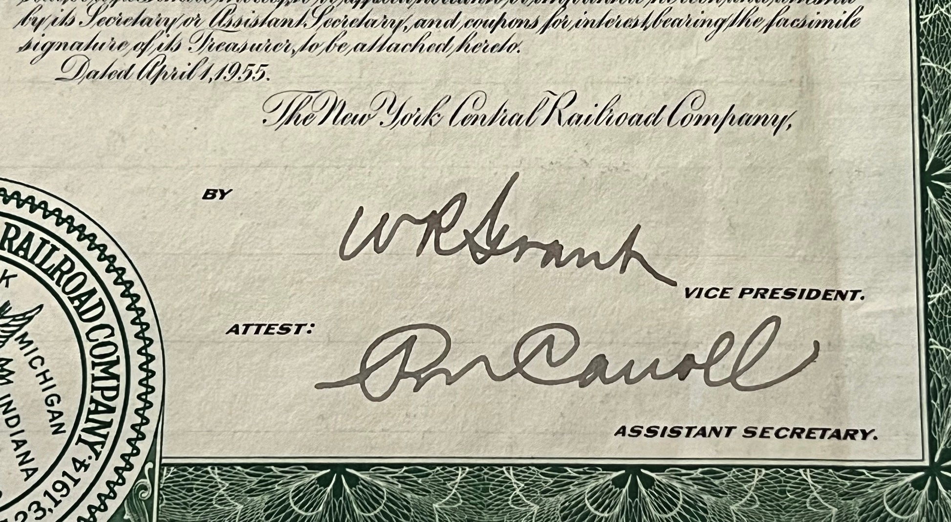 Close-up of vintage 1955 New York Central Railroad bond showing signatures, seal, and printed text in cursive and bold fonts 