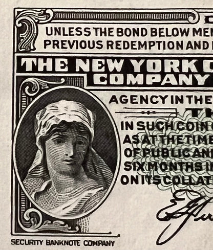 Close-up of vintage bond certificate corner showing engraved portrait in oval frame and "The New York Central Company" text w