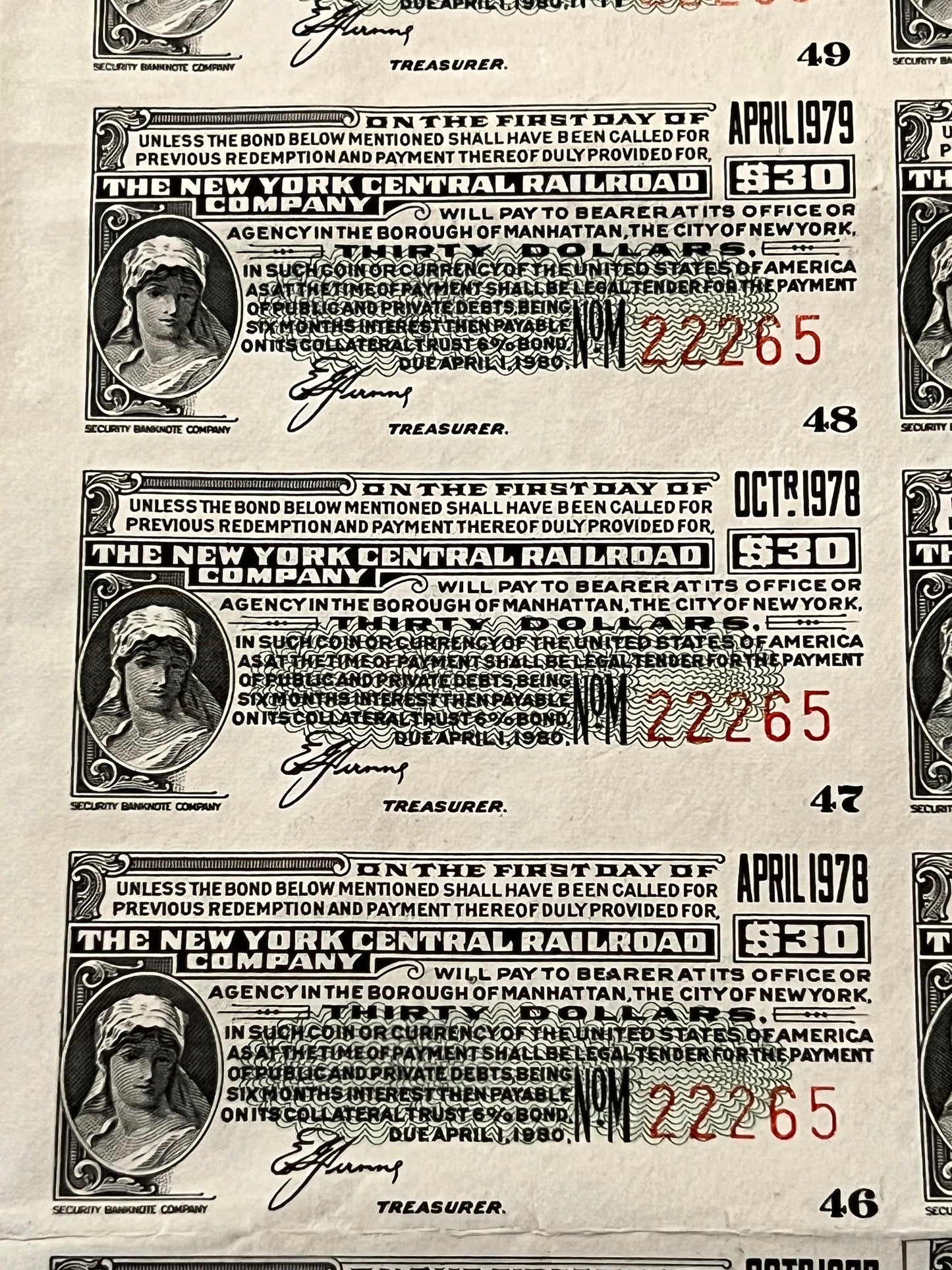 Three vintage New York Central Railroad bonds from 1978-1979 showing ornate engravings, denomination markings, and treasurer 