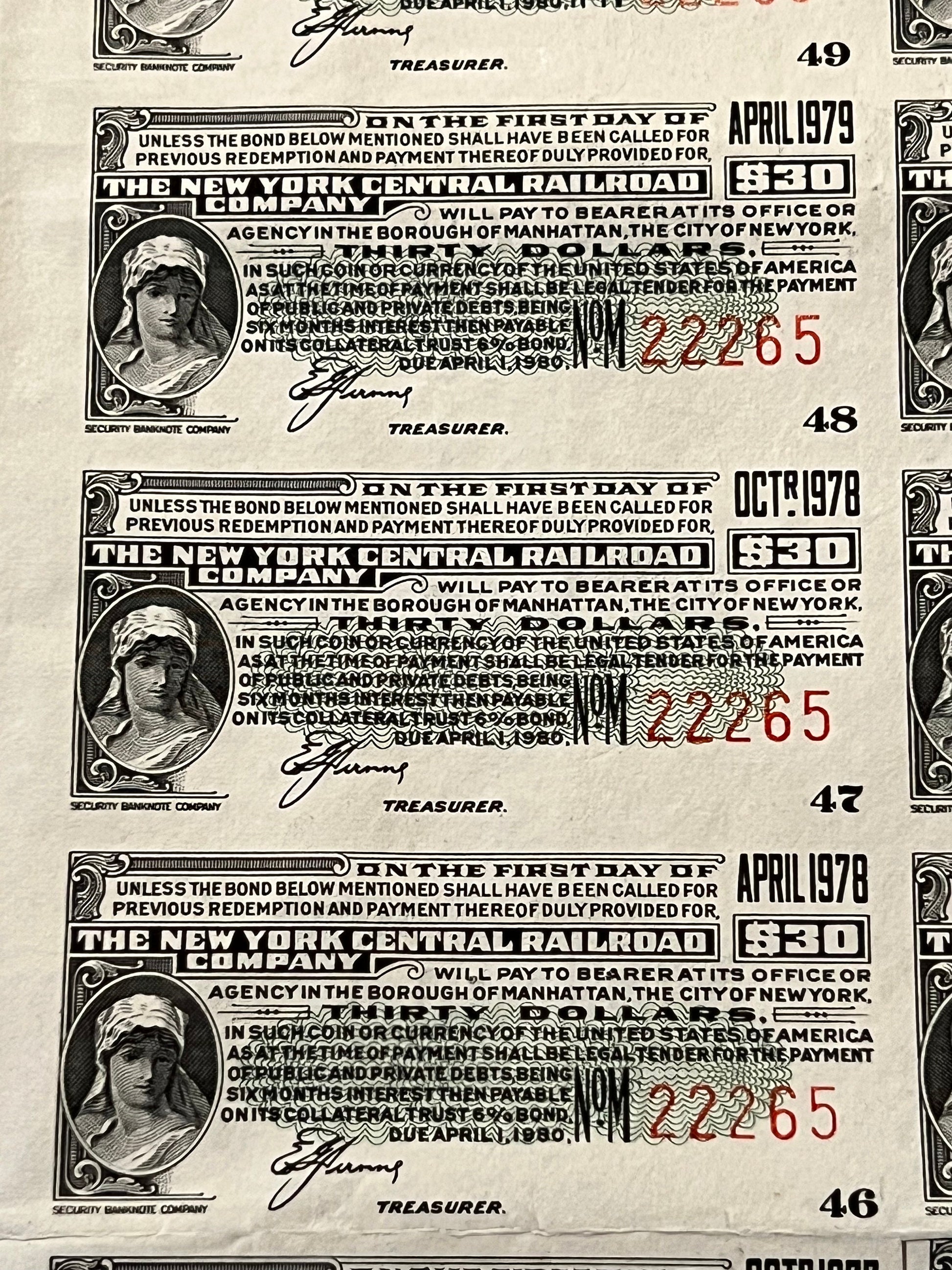 Three vintage New York Central Railroad bonds from 1978-1979 showing ornate engravings, denomination markings, and treasurer 
